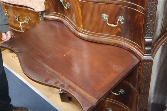 A 1920s Chippendale revival serpentine mahogany chest on chest W.90cm